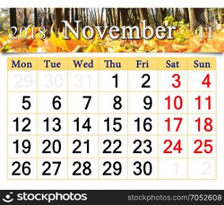 calendar for November 2018 with yellow leaves. calendar for November 2018 with the ribbon of yellow fallen leaves