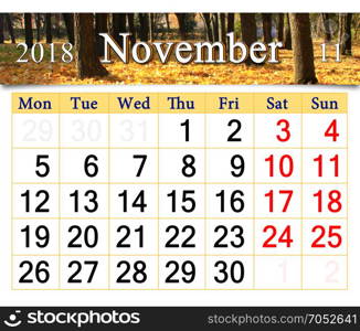 calendar for November 2018 with yellow leaves. calendar for November 2018 with the ribbon of yellow leaves in the autumnal park