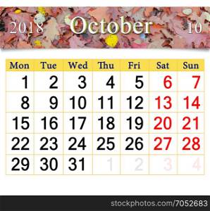 calendar for October 2018 with autumnal leaves. calendar for October 2018 with the ribbon of fallen autumnal leaves