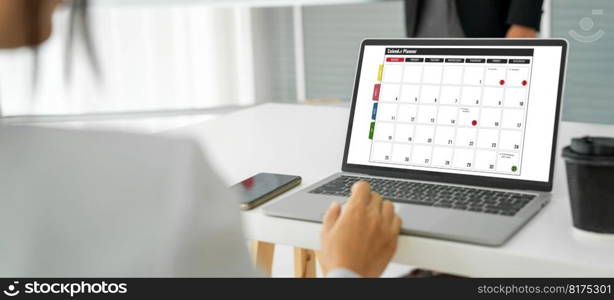 Calendar on computer software application for modish schedule planning for personal organizer and online business. Calendar on computer software application for modish schedule planning