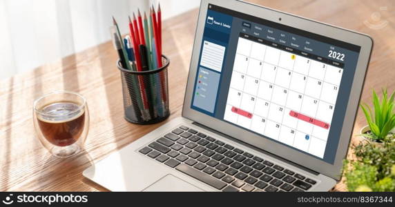 Calendar on computer software application for modish schedule planning for personal organizer and online business. Calendar on computer software application for modish schedule planning