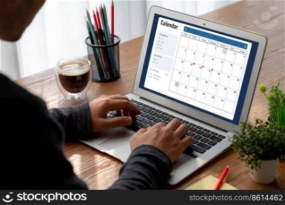 Calendar on computer software application for modish schedule planning for personal organizer and online business. Calendar on computer software application for modish schedule planning