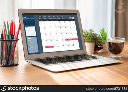 Calendar on computer software application for modish schedule planning for personal organizer and online business. Calendar on computer software application for modish schedule planning