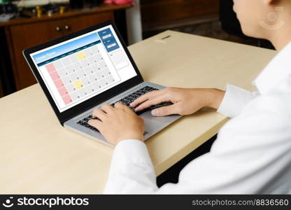 Calendar on computer software application for modish schedule planning for personal organizer and online business. Calendar on computer software application for modish schedule planning