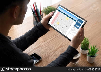 Calendar on computer software application for modish schedule planning for personal organizer and online business. Calendar on computer software application for modish schedule planning