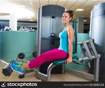 Calf extension woman at gym exercise machine workout indoor