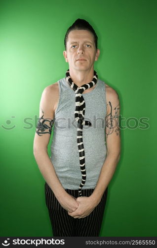 California Kingsnake draped around Caucasian mid-adult male&acute;s neck.