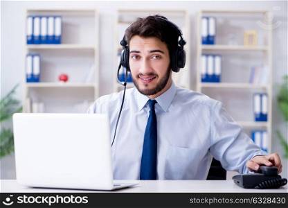 Call center employee working in office. The call center employee working in office
