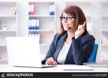 Call center operator working with clients. The call center operator working with clients