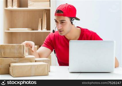 Call center worker at parcel distribution center in post office. The call center worker at parcel distribution center in post off