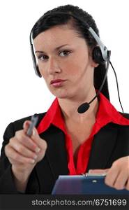 Call-center worker with pen and clip-board