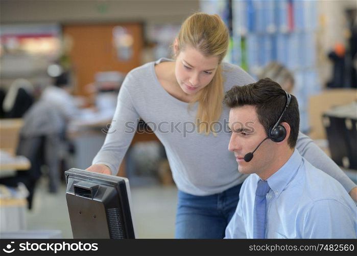 call centre workers looking at computer screen