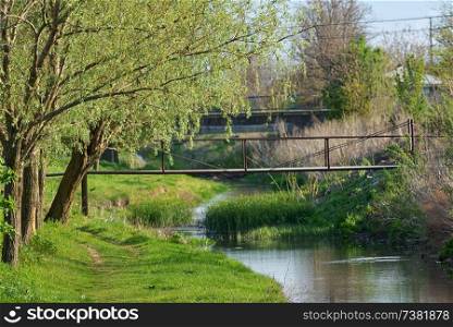 Calm countryside spring river scene village