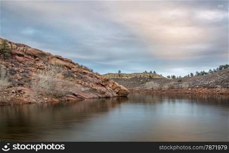calm dusk over a lake with redstone cliffs - Horsetooth Reservoir near Fort Collins in northern Colorado