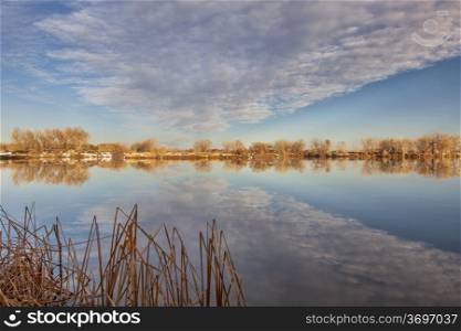 calm lake with cloud reflection - Arapaho Bend Natural Area in Fort Collins, Colorado