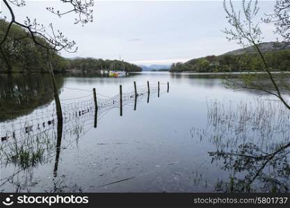 Calm moody evening landscape over Coniston Water in Lake District