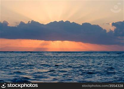 Calm ocean on tropical sunrise