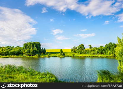 Calm river at sunny sunset in summer