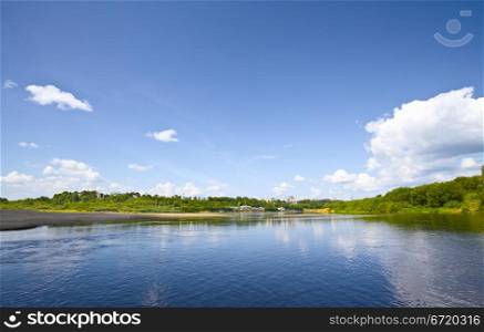 calm river under blue sky at summer day