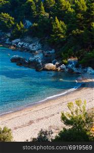 Calm sandy beach at Aegean sea on Sithonia, Halkidiki, Greece.
