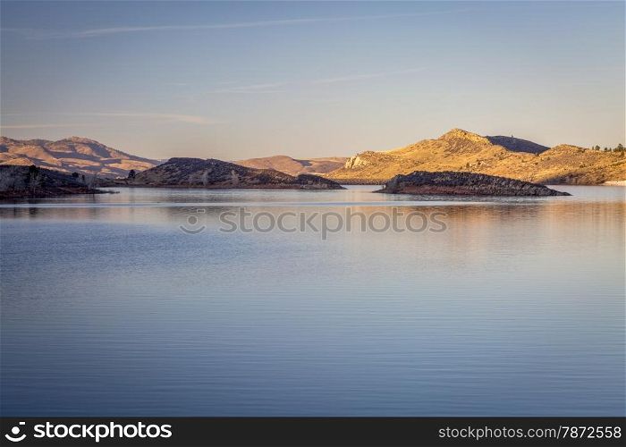 calm winter sunset over Horsetooth Reservoir near Fort Collins, Colorado