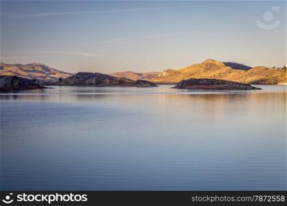 calm winter sunset over Horsetooth Reservoir near Fort Collins, Colorado