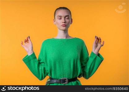 Calm woman relaxing, meditating, refuses stress. Blonde lady breathes deeply, calms down yellow studio background. Yoga, moral balance, zen concept. High quality. Calm woman relaxing, meditating, refuses stress. Pretty girl breathes deeply
