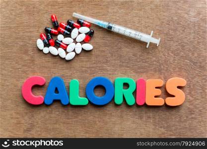 calories colorful word in the wooden background