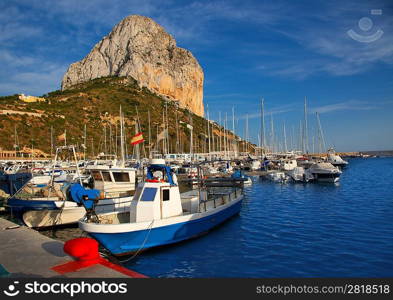 Calpe in alicante with Penon Ifach mountain and marina boats