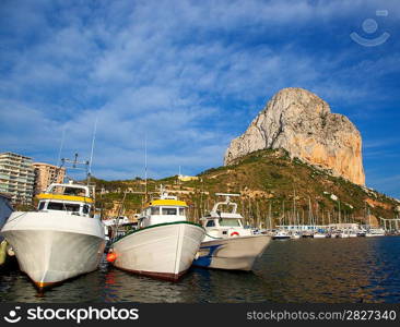 Calpe in alicante with Penon Ifach mountain and marina boats