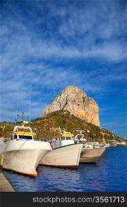 Calpe in alicante with Penon Ifach mountain and marina boats