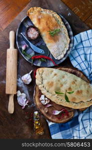 Calzone, closed pizza, Italian pastry stuffed with cheese, meat