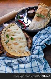 Calzone, closed pizza, Italian pastry stuffed with cheese, meat