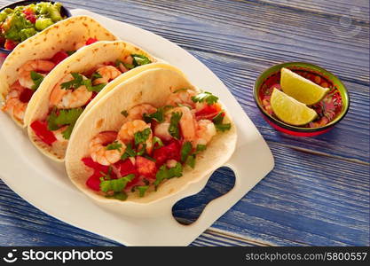 Camaron shrimp tacos mexican food on blue wood table