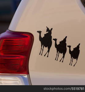 Camel-riding painting on a car, Ouarzazate, Morocco