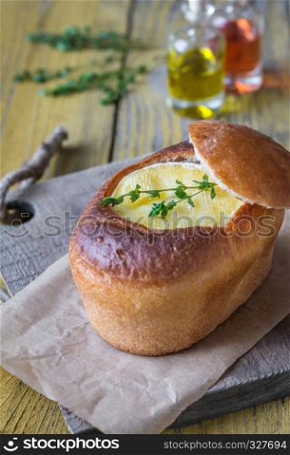 Camembert bread bowl decorated with fresh thyme