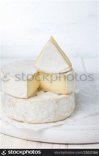 Camembert cheese on cutting board