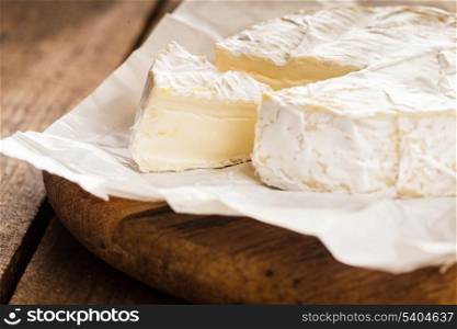 camembert cheese slice macro shot. Shallow DOF