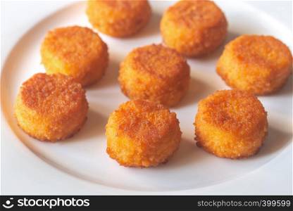 Camembert nuggets on the white plate