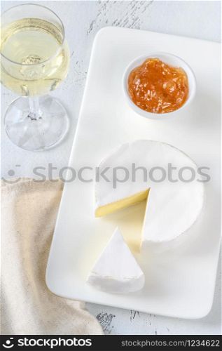 Camembert with glass of white wine