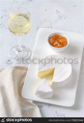 Camembert with glass of white wine
