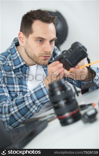 camera assembler inspecting the device