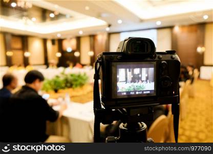 camera in business conference room recording participants and speaker echnology transformation of mirrorless camera