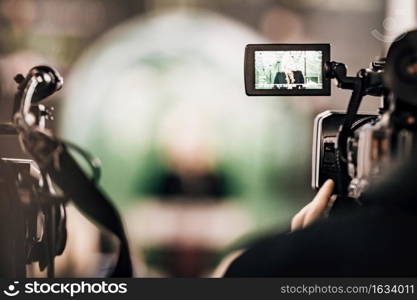 Cameraman Recording a Media Event