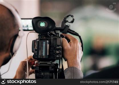 Cameraman Recording a Media Event