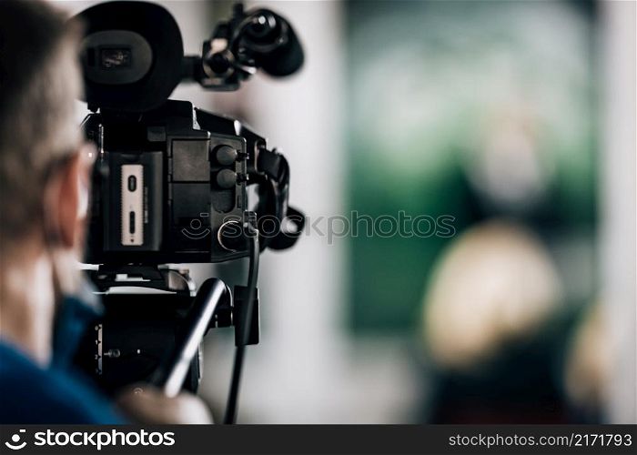 Cameraman Recording a Media Event