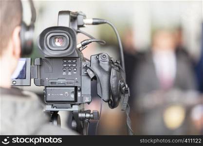 Cameraman working at press conference