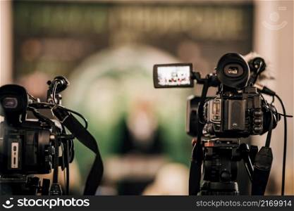 Cameras at a Live Media Conference.