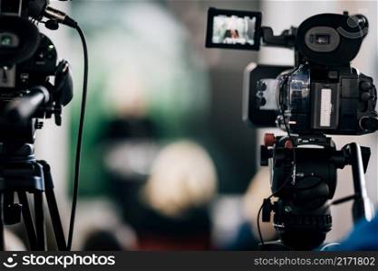 Cameras at a Live Media Conference.