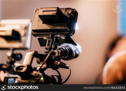 Cameras at a live media conference in the evening.. Night Press Conference. 